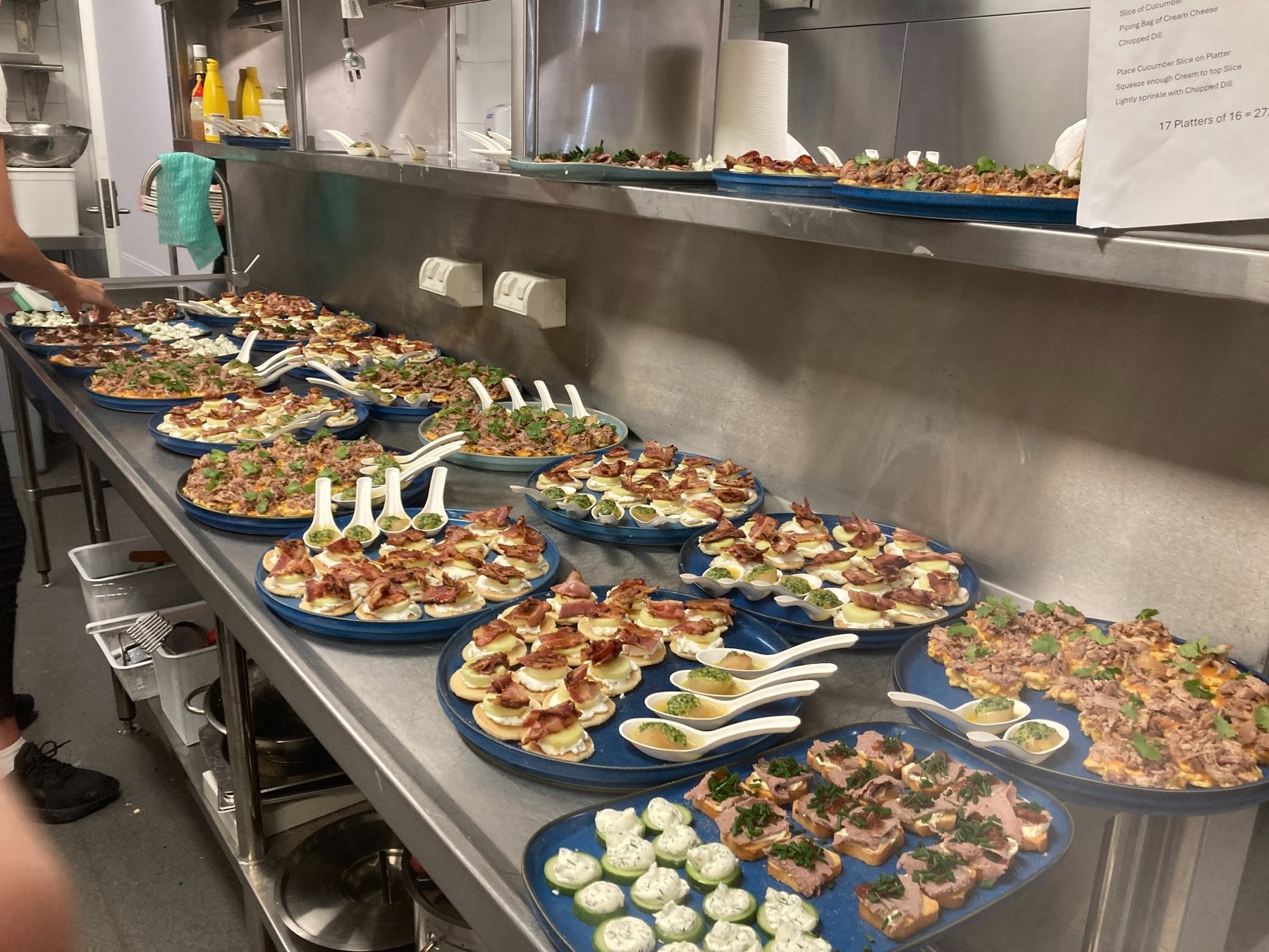 Many platters on a commercial kitchen pass
